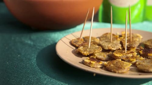 Plate of Fried Appetizers with Toothpicks