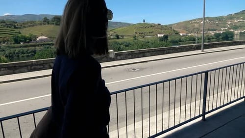 Young woman walking relaxing enjoying leisure time in the city street