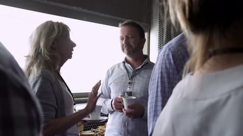 Networking at a Corporate Event with Coffee and Food
