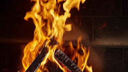 Burning Fireplace Logs with Warm Glowing Flames