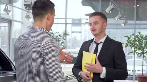 Successful Car Deal Between Two Young Men