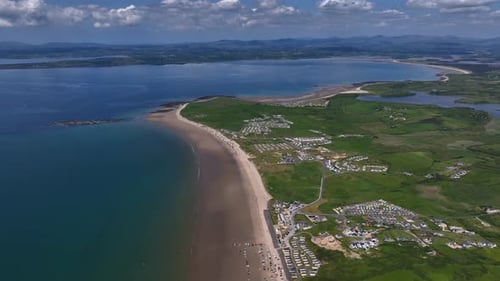 Rossnowlagh Beach, County Donegal, Ireland, June 2023. Drone pulls backwards above the picturesque c