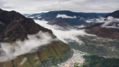 Aerial View of Mountains and Valley with Clouds