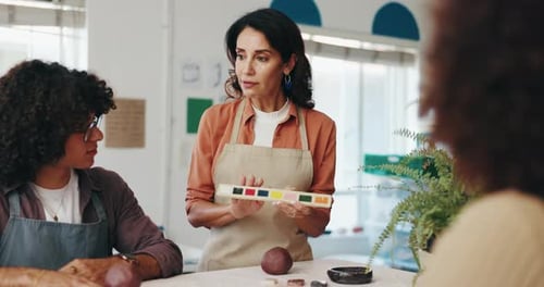 Pottery, painting and woman with people in workshop for skills with clay