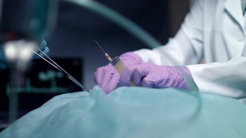 Surgeon Operating Process. Close Up of Anesthesiologist Hand Preparing for Anesthesia Injection