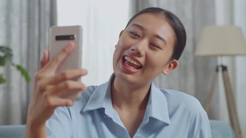 Young Adult Video Calling At Home