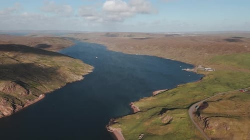 Aerial shot of a sea voe in Shetland at sunset in North Scotland