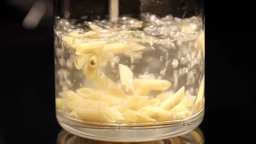 pasta, macaroni is cooked in a glass container