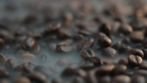 Close Up of Roasted Coffee Beans With Smoke