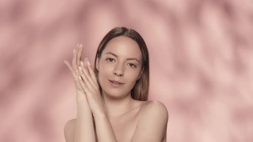 Woman Posing For Beauty Shot On Pink Background