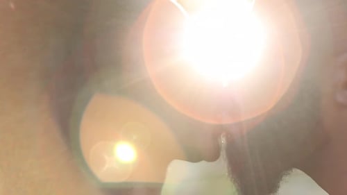 Affectionate Couple Kissing Passionately in Romantic Sunlight