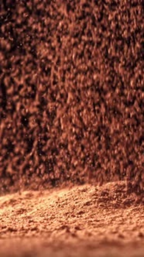 Cocoa Powder Falls on the Table Filmed on a Highspeed Camera at 1000 Fps