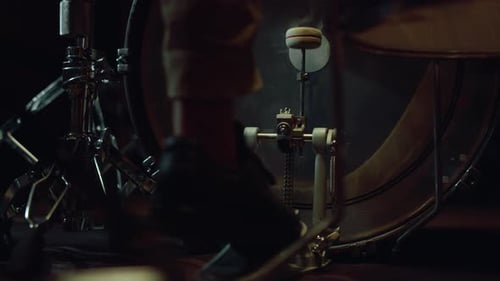 Rear View Of Man Leg Pressing Pedal Of Bass Drum In Sound Recording Studio. Unrecognizable Musici...