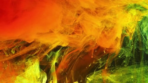 Colorful Rainbow Paint Drops From the Bottom Mixing in Water Closeup