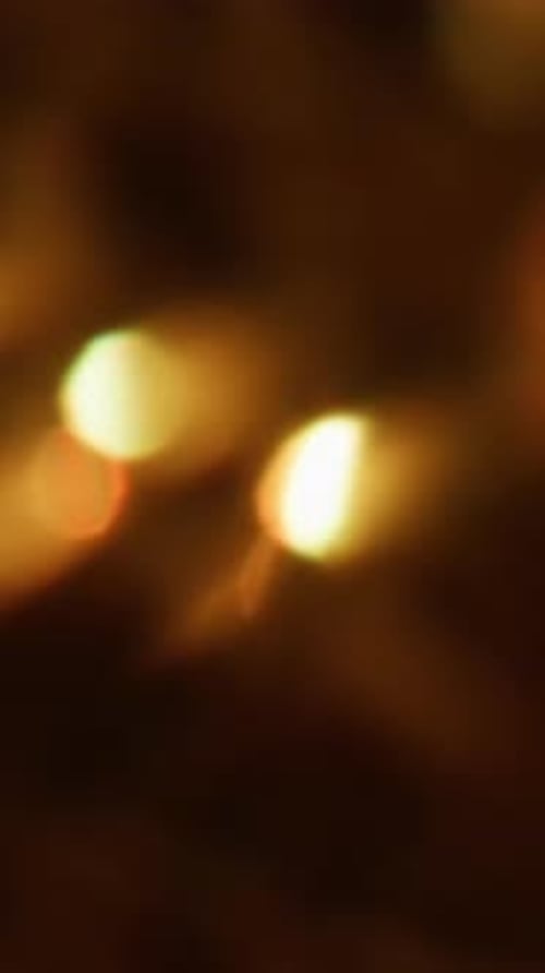 Blurred Golden Lights Bokeh Effect on Dark Background