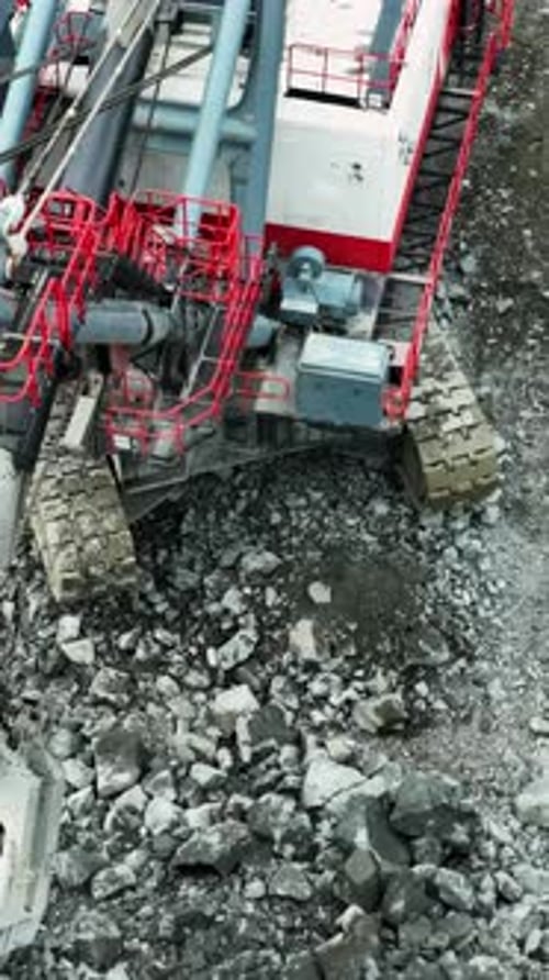 Excavator Loading Rocks Into Dump Truck in Quarry Stock Clip