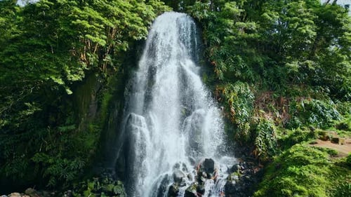 Tropical Waterfall Flowing Down on Sunny Day Mountain Water Stream Falling