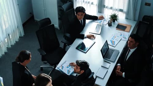 Top view of smart manager present financial graph to diverse team. Directorate.