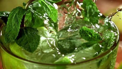 Fresh Lime, Mint, and Ice Drink Being Made