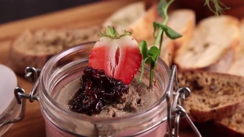 Delicious pate served with strawberry and bread