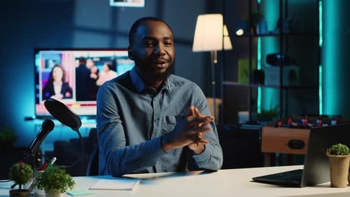 Man Talking Into a Microphone During a Broadcast