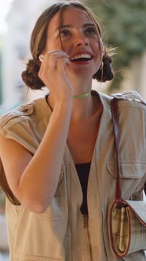 Happy Young Woman in Wireless Earphones Choosing Listening Music Dancing Outdoors City Street