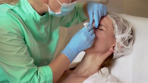 Injections Made By Professional Female Cosmetologist in Gloves Neurotoxin and Collagen Beauty