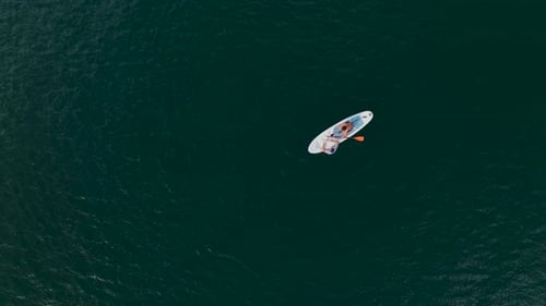 Aerial View Paddleboarding in the Beautiful Green Canyon Landscape