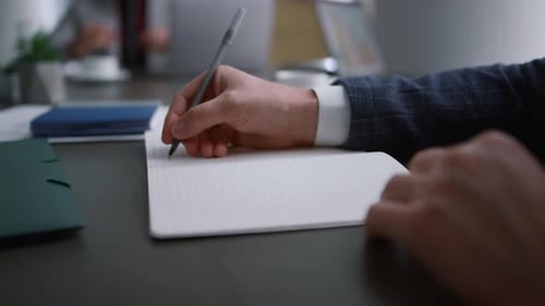 Entrepreneur signing contract document paperwork in corporate office environment