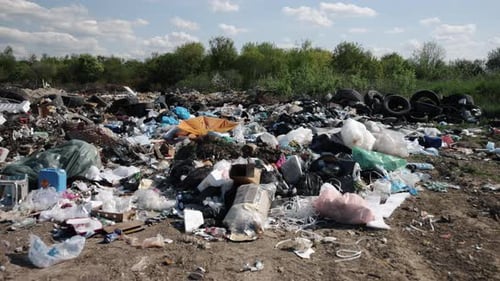 Illegal Landfill with Mountains of Garbage and Waste