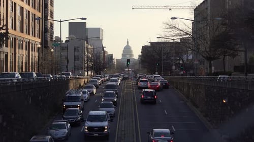 Capitol Dome at Sunset as Traffic Backs up Behind Police Road Closure before Joe Biden Inauguration,