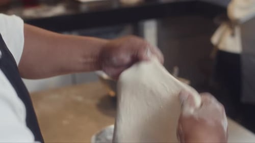 Baker Preparing Dough in Commercial Kitchen