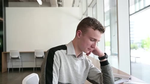 Student Researching with Digital Tablet in Library 1617 Years