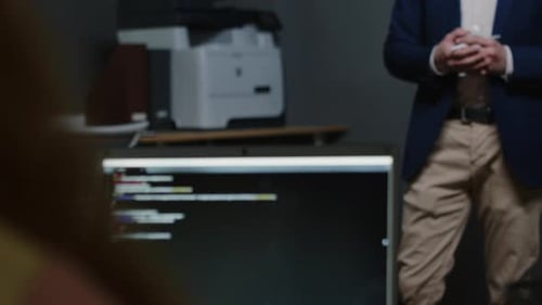 Bearded Man Giving Tech Presentation in Office