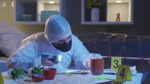 Forensic Scientist Examines Evidence with Swab and Flashlight