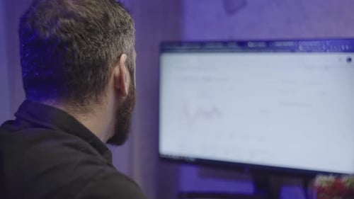 A Serious Man Works at a Computer