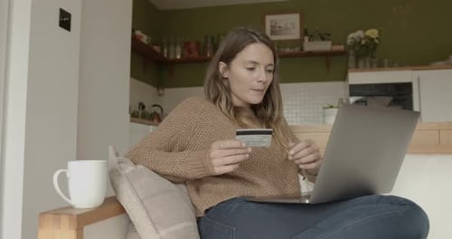 Woman Shopping Online at Home with Laptop