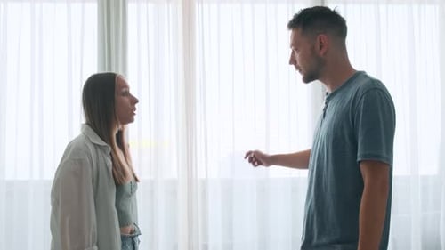 Woman Arguing with Man During a Tense Conversation