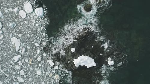 Ocean Wave in Ice and Snow Rock Glacier Aerial Top Down View
