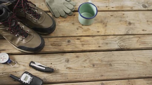 Camping Gear Arranged on a Wooden Table