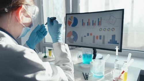 Scientist Working in Bright Lab With Test Samples