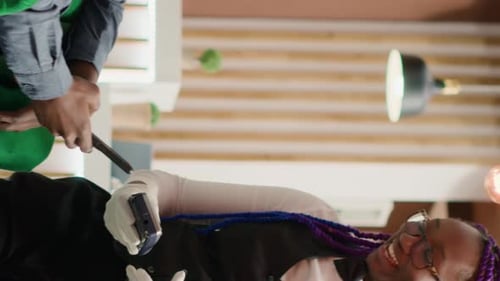 Person paying bill to individual with mobile device