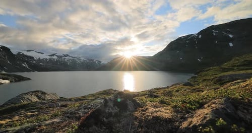 Sunset against the backdrop of the Norwegian mountains. Beautiful Nature Norway natural landscape.