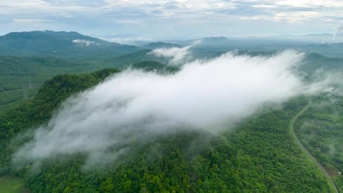 Aerial view morning scenery Mist flowing over the high mountains.