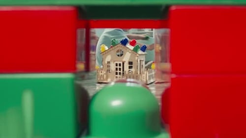 Children Play with Building Blocks in Playroom