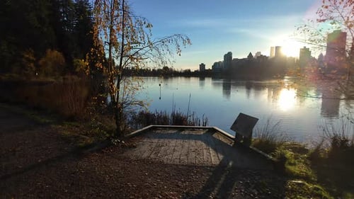 View of Lost Lagoon Famous Stanley Park Sunny Fall Morning City Buildings Skyline in Background