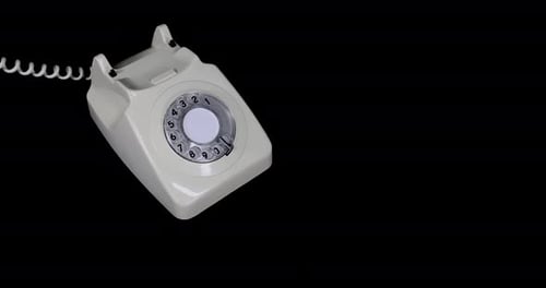 An old style phone being picked and and answered while ringing by a mans hand