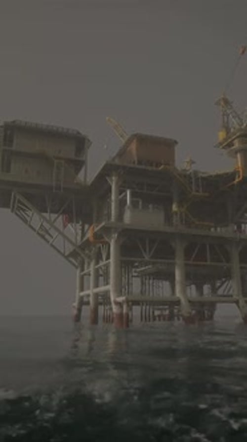 An Offshore Oil Rig Standing Tall in the Vast Expanse of the Open Ocean