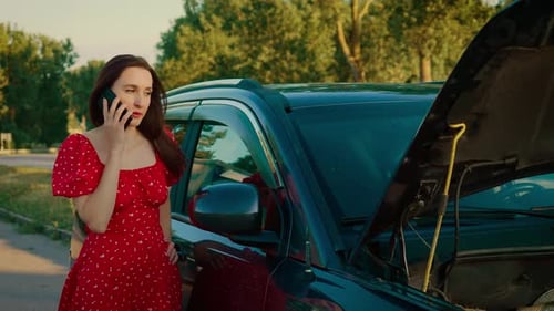 Woman on Phone Next to Car on Rural Road