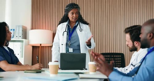 Medical Professionals Meeting in Office to Discuss Healthcare